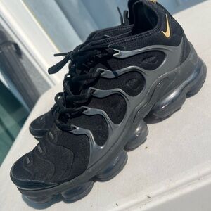 Nike Black Athletic Sneakers with Gold Swoosh